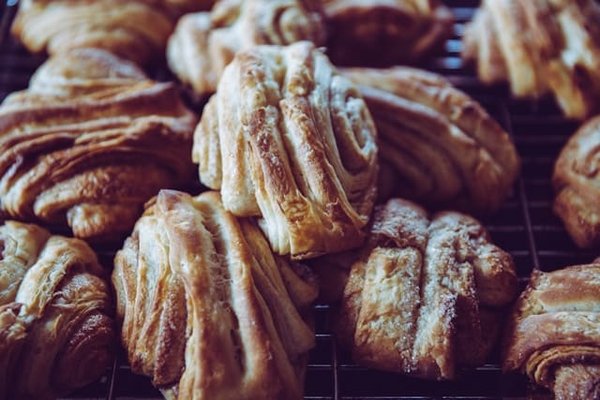 What's the Key to a Perfect Flaky Croissant with a Raspberry and Almond Filling?
